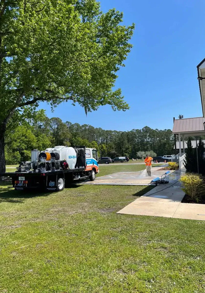Pristine open-concept home interior featuring light wood-look tile flooring and fresh white walls expertly finished by Top-Rated Painters in Orange Park FL.